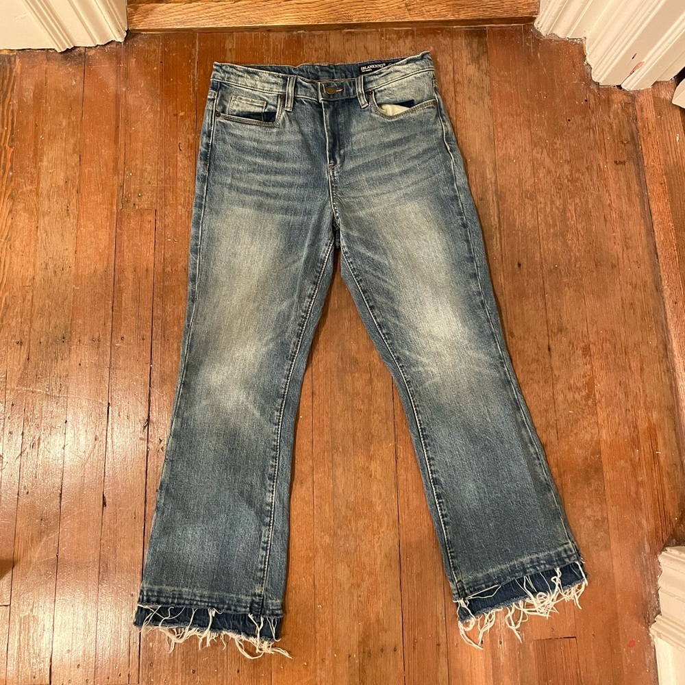 Pair of blue jeans with unique cutoff semi cropped leg (high rise)
